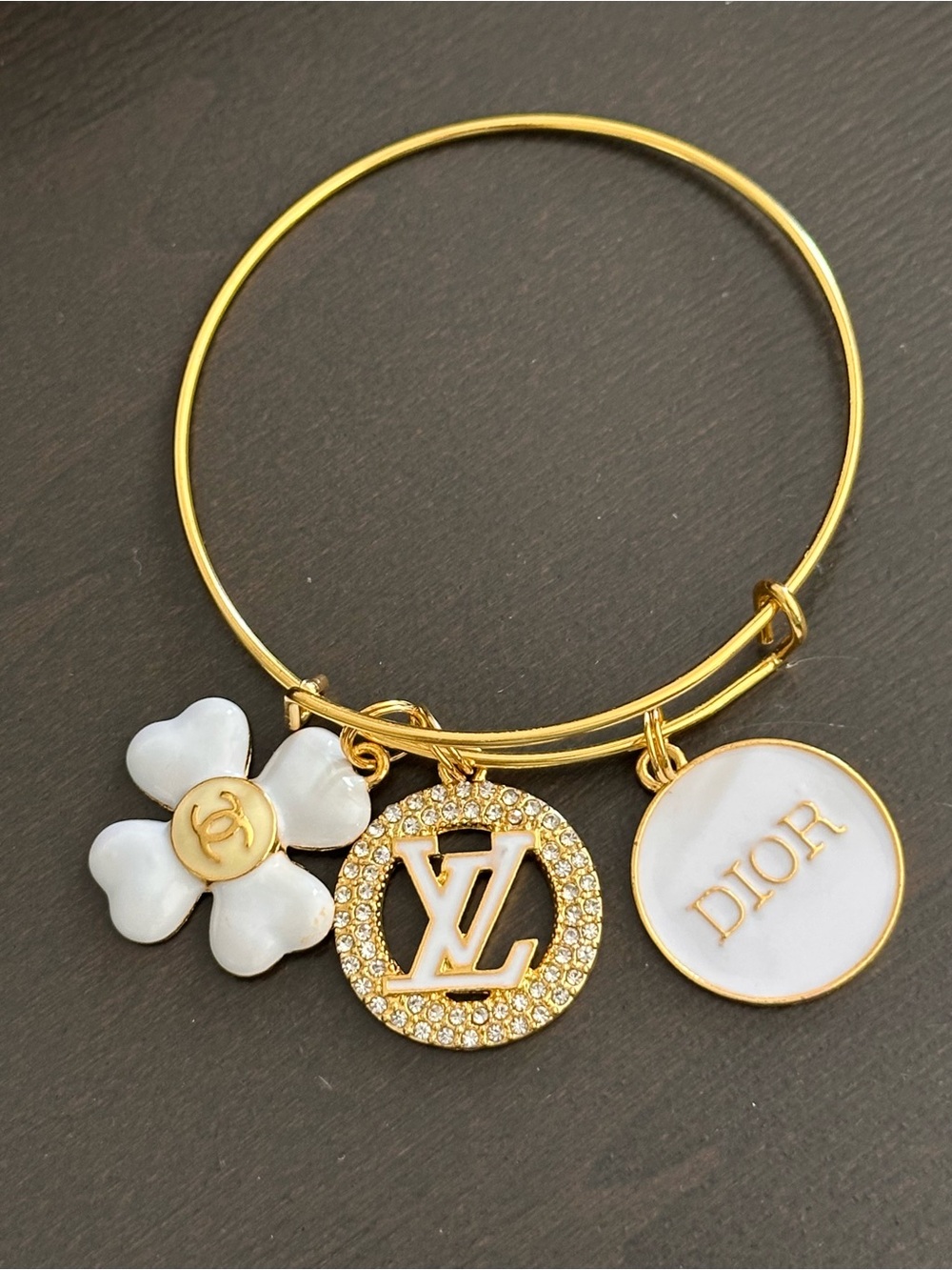 No Boundaries Gold Tone Charm Bangle with White Enamel Accents